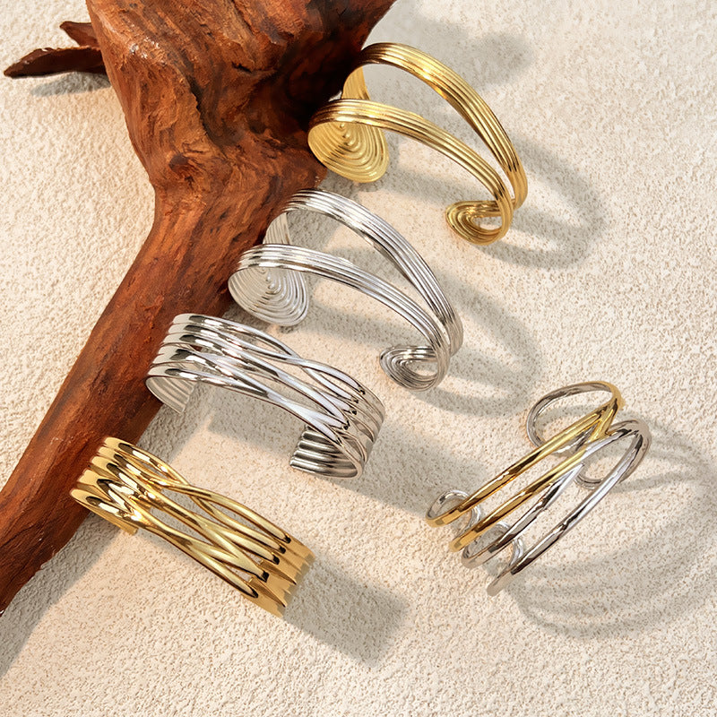 1 Stück unregelmäßig geformtes Manschettenarmband aus Edelstahl in Goldfarbe