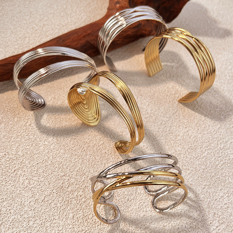 1 Stück unregelmäßig geformtes Manschettenarmband aus Edelstahl in Goldfarbe