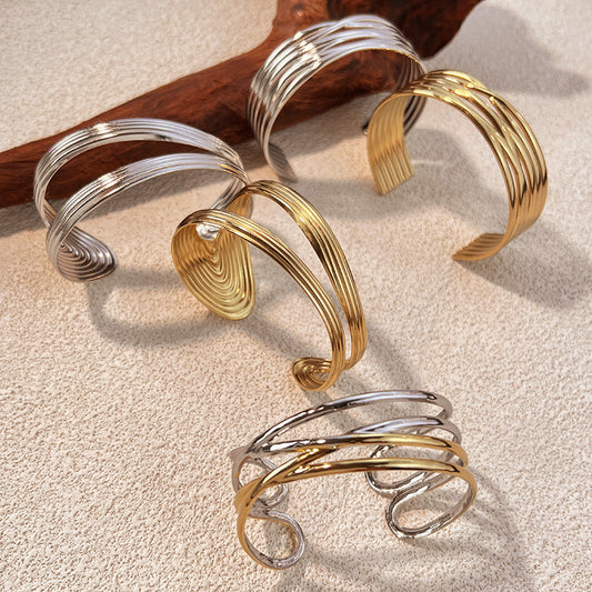 1 Stück unregelmäßig geformtes Manschettenarmband aus Edelstahl in Goldfarbe