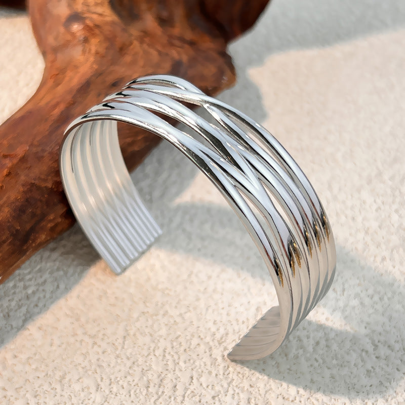 1 Stück unregelmäßig geformtes Manschettenarmband aus Edelstahl in Goldfarbe