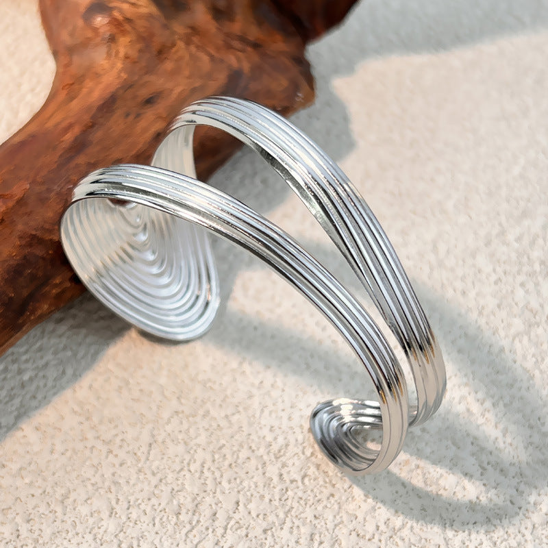 1 Stück unregelmäßig geformtes Manschettenarmband aus Edelstahl in Goldfarbe