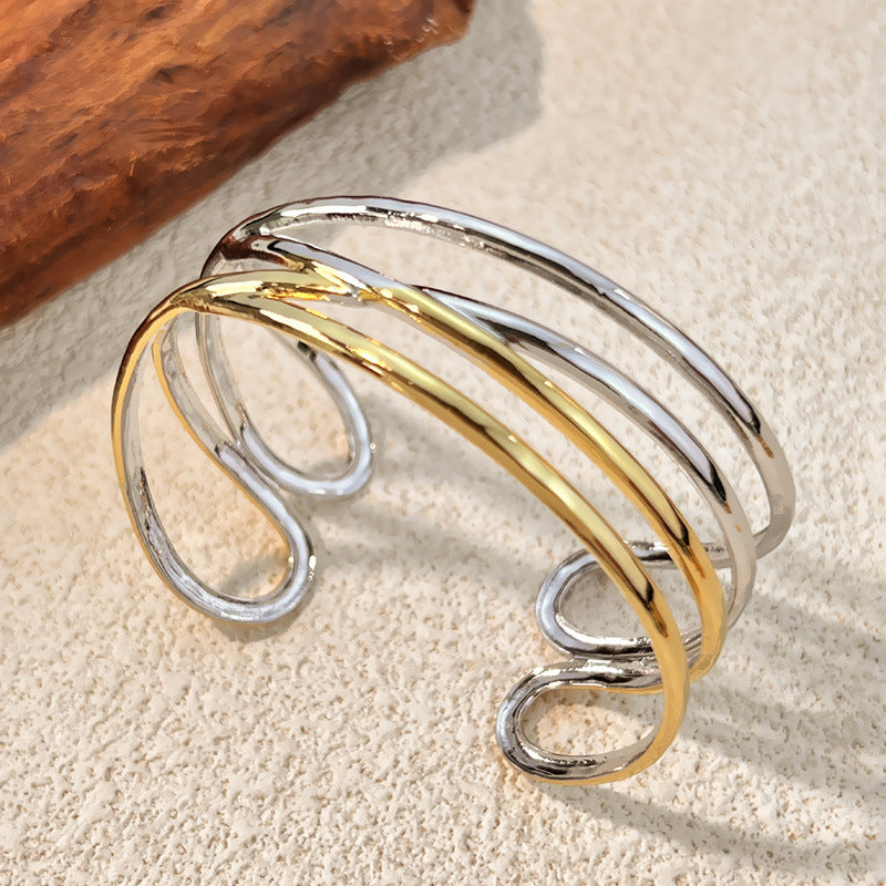 1 Stück unregelmäßig geformtes Manschettenarmband aus Edelstahl in Goldfarbe