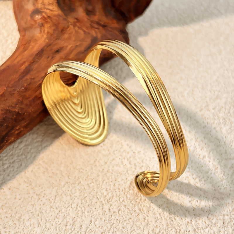 1 Stück unregelmäßig geformtes Manschettenarmband aus Edelstahl in Goldfarbe
